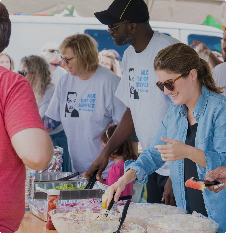A group of volunteers serving food to the community.